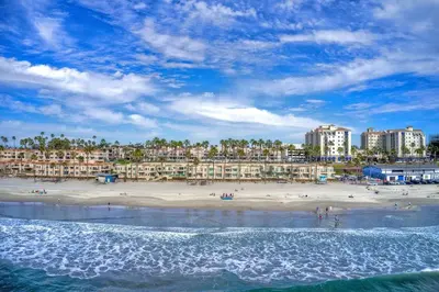 a view of a beach with buildings in the background at San Miguel #8 in Oceanside