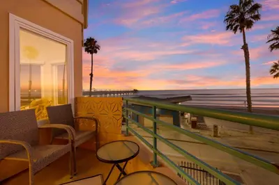 a balcony with chairs and a view of the ocean at San Miguel #8 in Oceanside