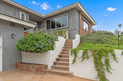 a house with stairs and plants in front of it at Designer 4 BR La Mesa Home w/ Yard and BBQ in La Mesa