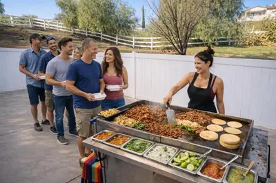 a group of people standing around a barbecue grill at Ask about the 100 Dollar Taco Caterer for 10 and Free Wine Tickets in Temecula
