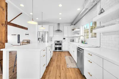 a kitchen with white cabinets and a wooden floor at Ask about the 100 Dollar Taco Caterer for 10 and Free Wine Tickets in Temecula