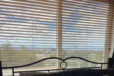 a bedroom window with a view of the outdoors at Chick-Ranch Guest House in Temecula