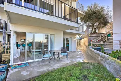 a house with a patio with a table and chairs at San Clemente Condo with Gorgeous Views Near Beach! in San Clemente