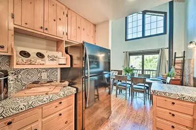 a kitchen with a stainless steel refrigerator and a dining room at Inviting Julian Home with Scenic View and Hot Tub in Julian