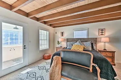 a bedroom with a bed and a large window at Inviting Julian Home with Scenic View and Hot Tub in Julian