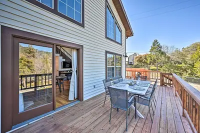 a wooden deck with a table and chairs on it at Inviting Julian Home with Scenic View and Hot Tub in Julian