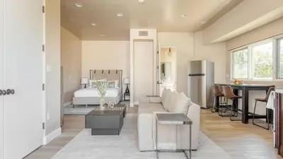 a living room with a couch and a bed at Modern Temecula Mansion w Pool Hot Tub Guest House Valley Views Camila by AvantStay in Temecula