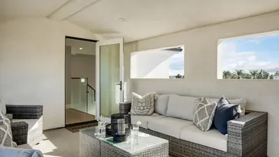 a living room with a couch and a table at Sea Crown by AvantStay 5mins from the Beach w Multiple Terraces PermitSLP13639 in Newport Beach