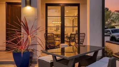 a patio with a table and chairs and a table at Sea Crown by AvantStay 5mins from the Beach w Multiple Terraces PermitSLP13639 in Newport Beach