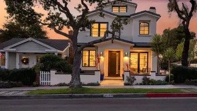 a white house with a tree in front of it at Sea Crown by AvantStay 5mins from the Beach w Multiple Terraces PermitSLP13639 in Newport Beach