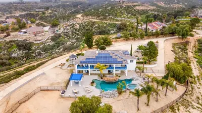 an aerial view of a house with a swimming pool at 5-Acre Hilltop Estate w Resort Pool Game Room Le Grand Bleu by AvantStay in Temecula