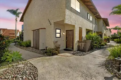 a house with a pathway leading to the front door at Carlsbad Hideway Pool Spa in Carlsbad