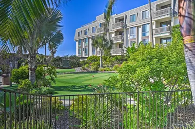 a view of a building with a golf course in front at Deja Blue Oceanside Condo on Beach with Pools! in Oceanside