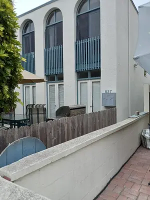 a wooden fence in front of a building at Master SUITE STEPS TO BAY & BEACH in San Diego