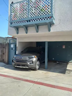 a car is parked inside of a garage at Master SUITE STEPS TO BAY & BEACH in San Diego