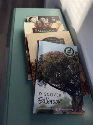 three books sitting on top of a table at Aviation Landing in Fallbrook