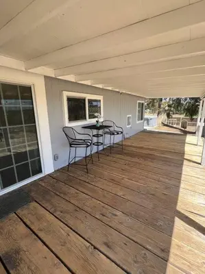 a porch with chairs and a table on a house at Temecula Rejuvenation in Temecula