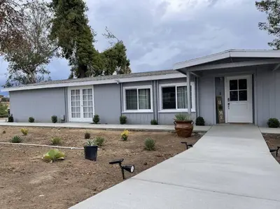 a gray house with a driveway in front of it at Temecula Rejuvenation in Temecula