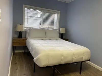 a large bed in a room with a window at Rejuvenation Cottage - Wine Country Tranquility in Temecula