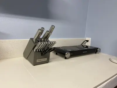 a knife block with four knives in it on a counter at Rejuvenation Cottage - Wine Country Tranquility in Temecula