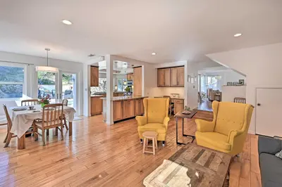 a kitchen and living room with a table and chairs at Spacious San Diego House with Yard and Patio! in San Diego