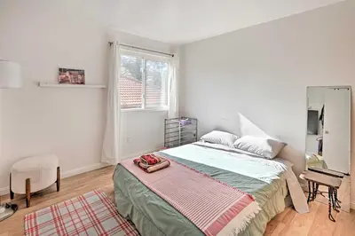 a bedroom with a large bed and a window at Spacious San Diego House with Yard and Patio! in San Diego