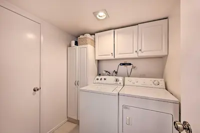 a white laundry room with a washer and dryer at Spacious San Diego House with Yard and Patio! in San Diego