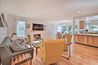 a living room with a couch and a table at Spacious San Diego House with Yard and Patio! in San Diego