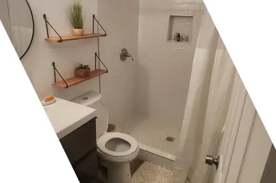 a bathroom with a shower with a toilet and a sink at Gated Mountain Villa w/ Private Garage and King Bed in Lake Elsinore