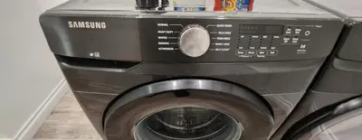 a washing machine sitting next to a washer at Gated Mountain Villa w/ Private Garage and King Bed in Lake Elsinore