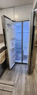 an empty refrigerator with its door open in a room at Gated Mountain Villa w/ Private Garage and King Bed in Lake Elsinore