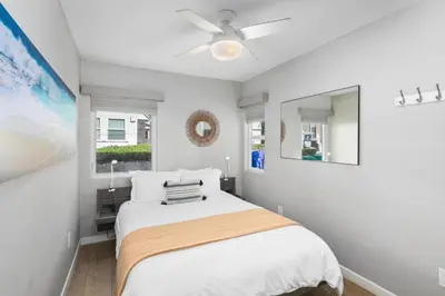 a bedroom with a bed and a ceiling fan at 7BD Family, Event Friendly, 2 blocks to Beach, Boardwalk in San Diego