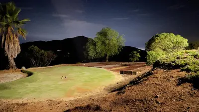 a golf course with a player on the green at Private Home on 10 Acres - Heated Salt Pool & Jacuzzi, Mountain & City Views, Horseshoes, Basketball, BBQ, Golf Putting, Foosball, Croquet, Bose Stereo, White Cotton Bedding - Hilltop Hacienda, Pool Heat Optional in Jamul