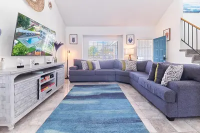 a living room with a couch and a tv at Entire Mountain Oasis Home in Hemet