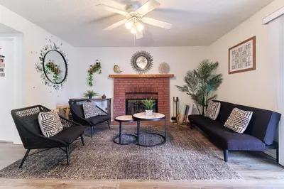 a living room with a couch and a fireplace at Entire Mountain Oasis Home in Hemet