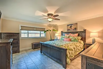 a bedroom with a bed and a ceiling fan at Vista Home with Pool about 11 Mi to Tamarack State Beach in Vista