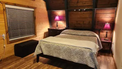 a bedroom with two beds and two lamps on tables at Julian House of Games in Julian