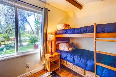 two bunk beds in a room with a window at Fallbrook Vacation Rental 3 Mi to Wineries! in Fallbrook