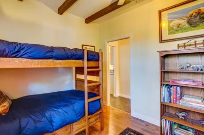a room with two bunk beds and a book shelf at Fallbrook Vacation Rental 3 Mi to Wineries! in Fallbrook