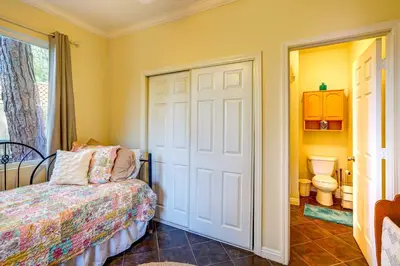 a bedroom with a bed and a toilet and a door at Fallbrook Vacation Rental 3 Mi to Wineries! in Fallbrook