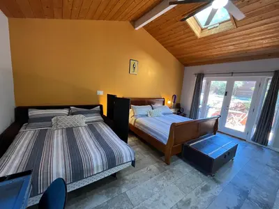 a bedroom with two beds and a window at On Site Parking King Master Suite UCSD Walk in San Diego