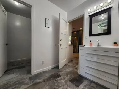 a white bathroom with a sink and a mirror at Private Room1 Own Bath Own Entry Shared Kitchen Walk to UCSD in San Diego