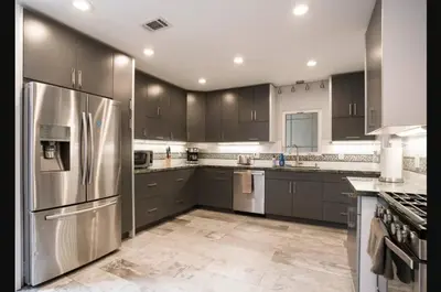 a kitchen with stainless steel appliances and gray cabinets at Private Room1 Own Bath Own Entry Shared Kitchen Walk to UCSD in San Diego