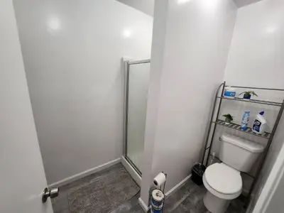 a small bathroom with a toilet and a shower at Private Room1 Own Bath Own Entry Shared Kitchen Walk to UCSD in San Diego
