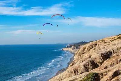 a group of people flying kites over the ocean at Private Room0 Own Bath Own Entry Shared Kitchen Walk to UCSD in San Diego