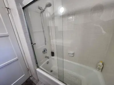 a bathroom with a shower and a bath tub at Private Room2 Own Entry Shared Bath One Guest Walk to UCSD in San Diego