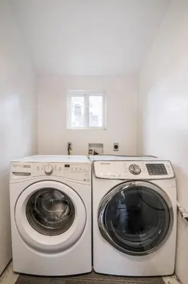 a laundry room with a washer and dryer at Private Room2 Own Entry Shared Bath One Guest Walk to UCSD in San Diego