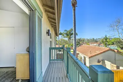 a balcony with a view of a house at Bright Townhome in Carlsbad 1 Mile to Beach! in Carlsbad