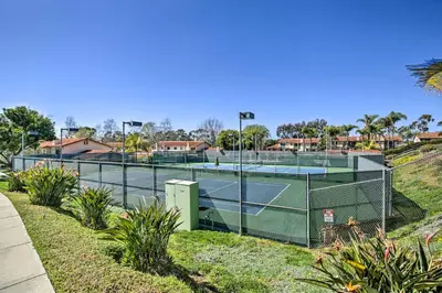 a tennis court with two tennis courts at Bright Townhome in Carlsbad 1 Mile to Beach! in Carlsbad