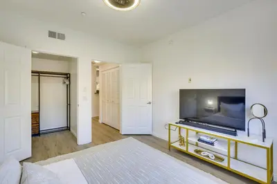 a living room with a flat screen tv on a table at Modern Pet-Friendly San Diego Vacation Rental in San Diego